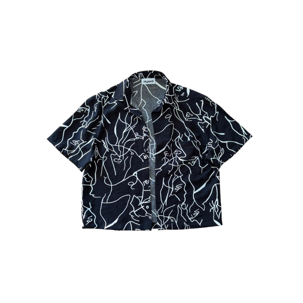 Black shirt with white abstract patterns on a white background