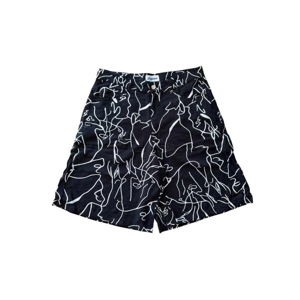 Black shorts with white abstract patterns on a white background