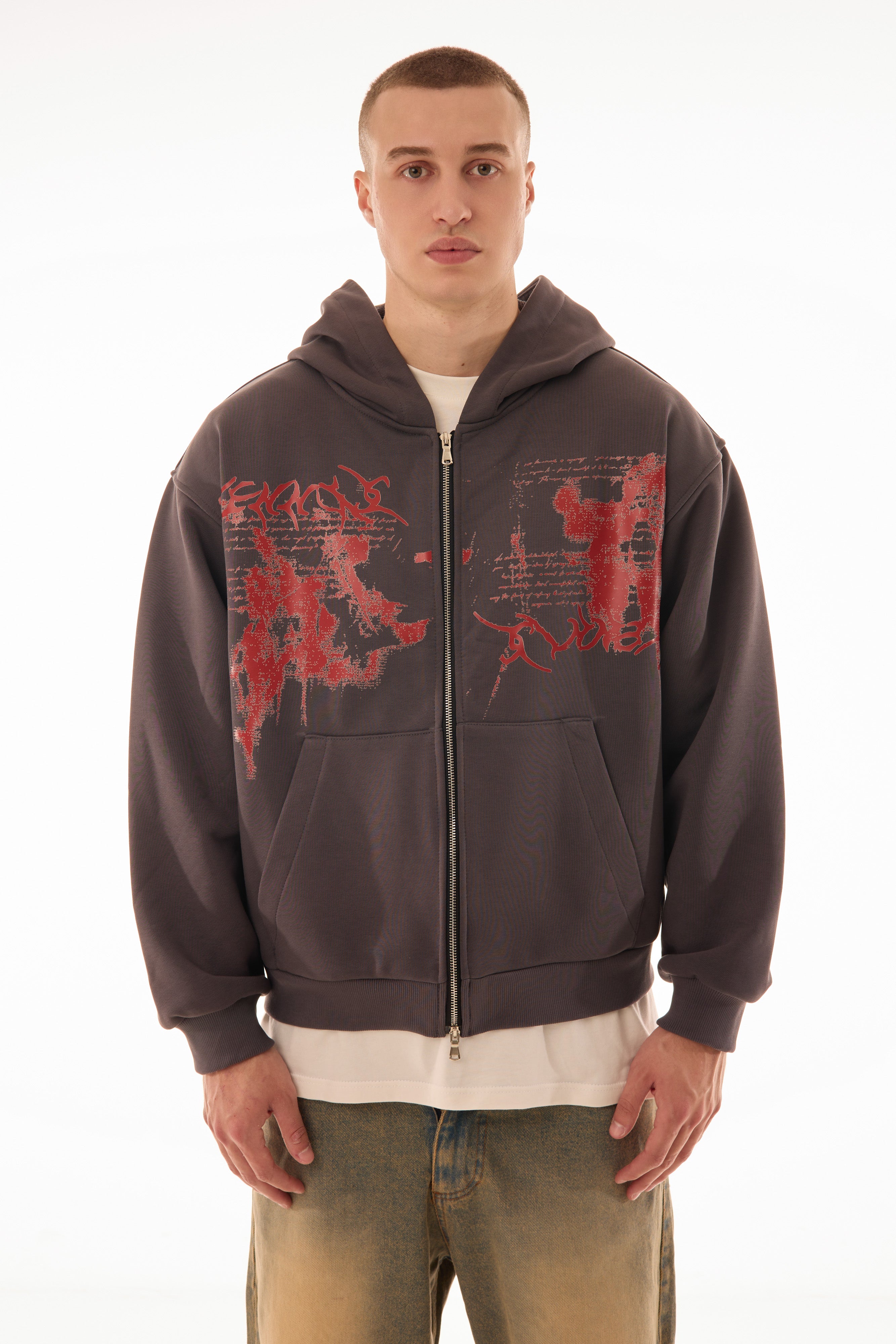 Model wearing Relic Grey zip up hoodie with red graphic print on front, premium 500 GSM cotton, oversized fit — streetwear zip hoodie