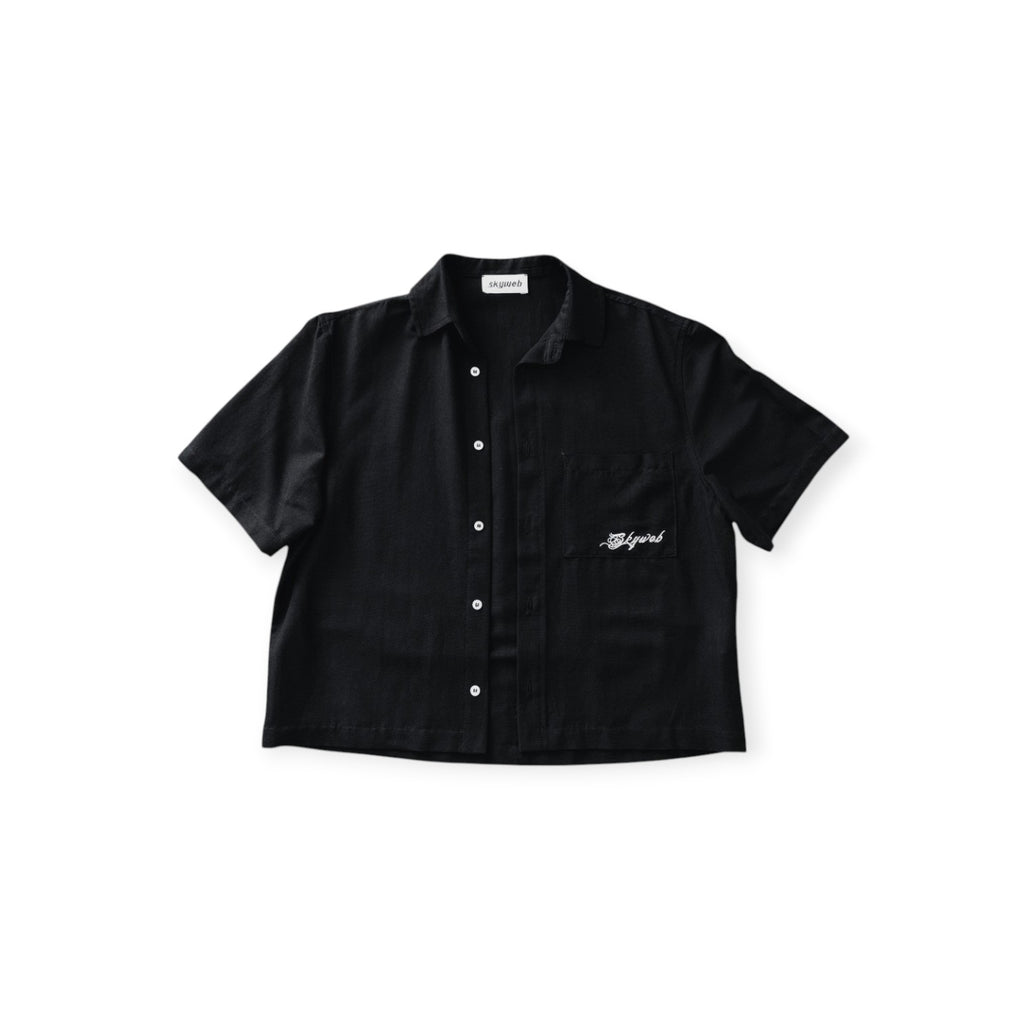 Black short-sleeve shirt with a brand logo on a white background