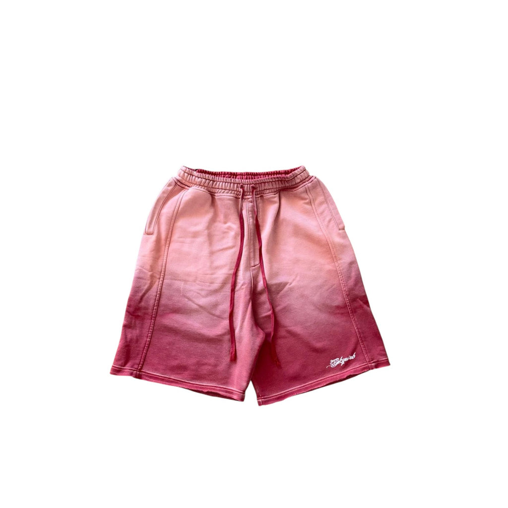 Pink shorts with a gradient effect on a white background