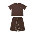 Brown t-shirt and shorts set on a white background