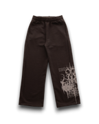 Dark brown wide-leg sweatpants with a white distressed graphic print on the lower right leg, displayed on a clean white background.