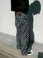 SKYWEB baggy black and white checkerboard denim jeans with raised frayed squares and a raw hem in a relaxed fit