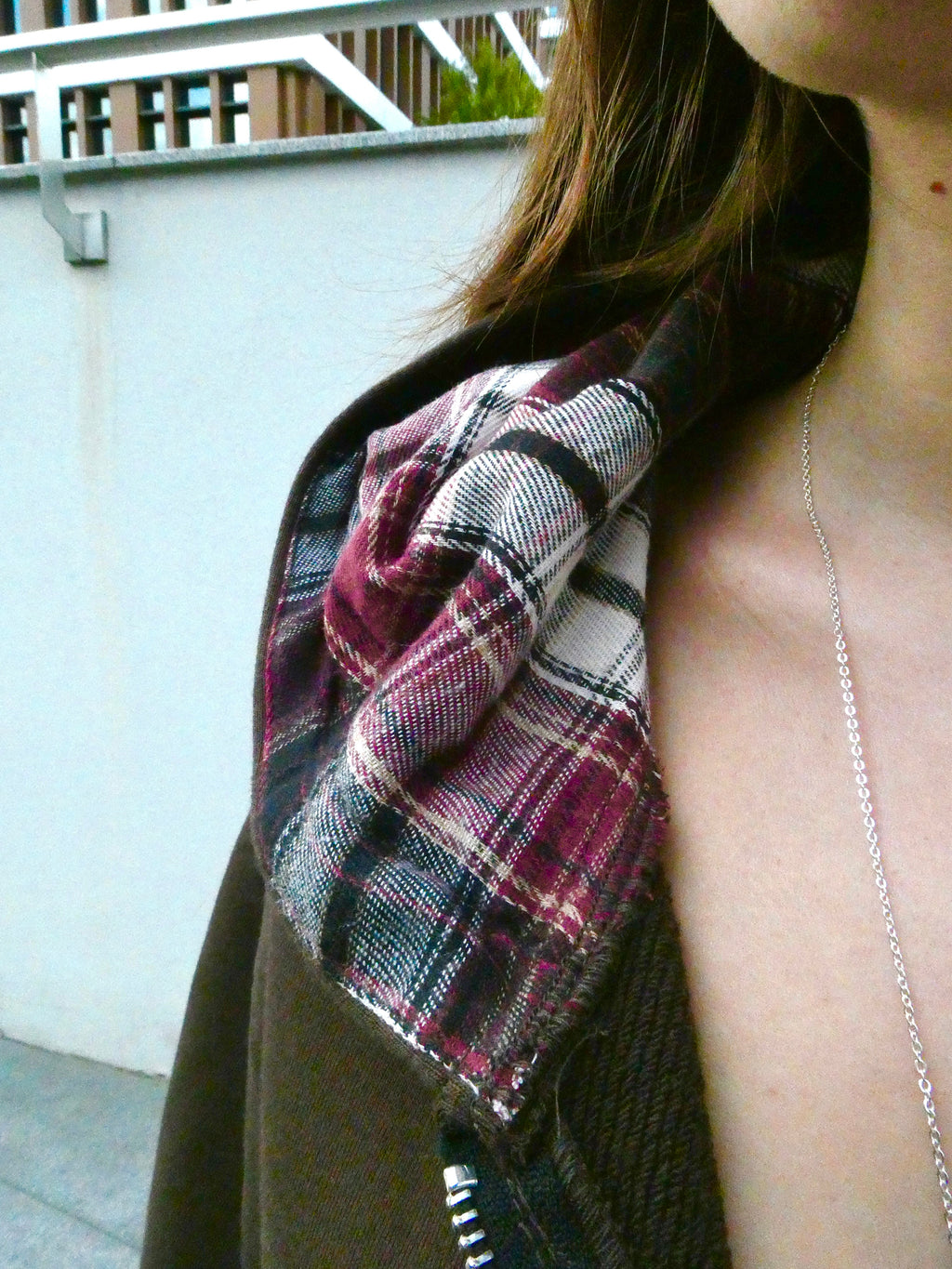 SKYWEB Fracture zip-up hoodie featuring a rust french terry body and a burgundy, white, and grey plaid flannel hood.