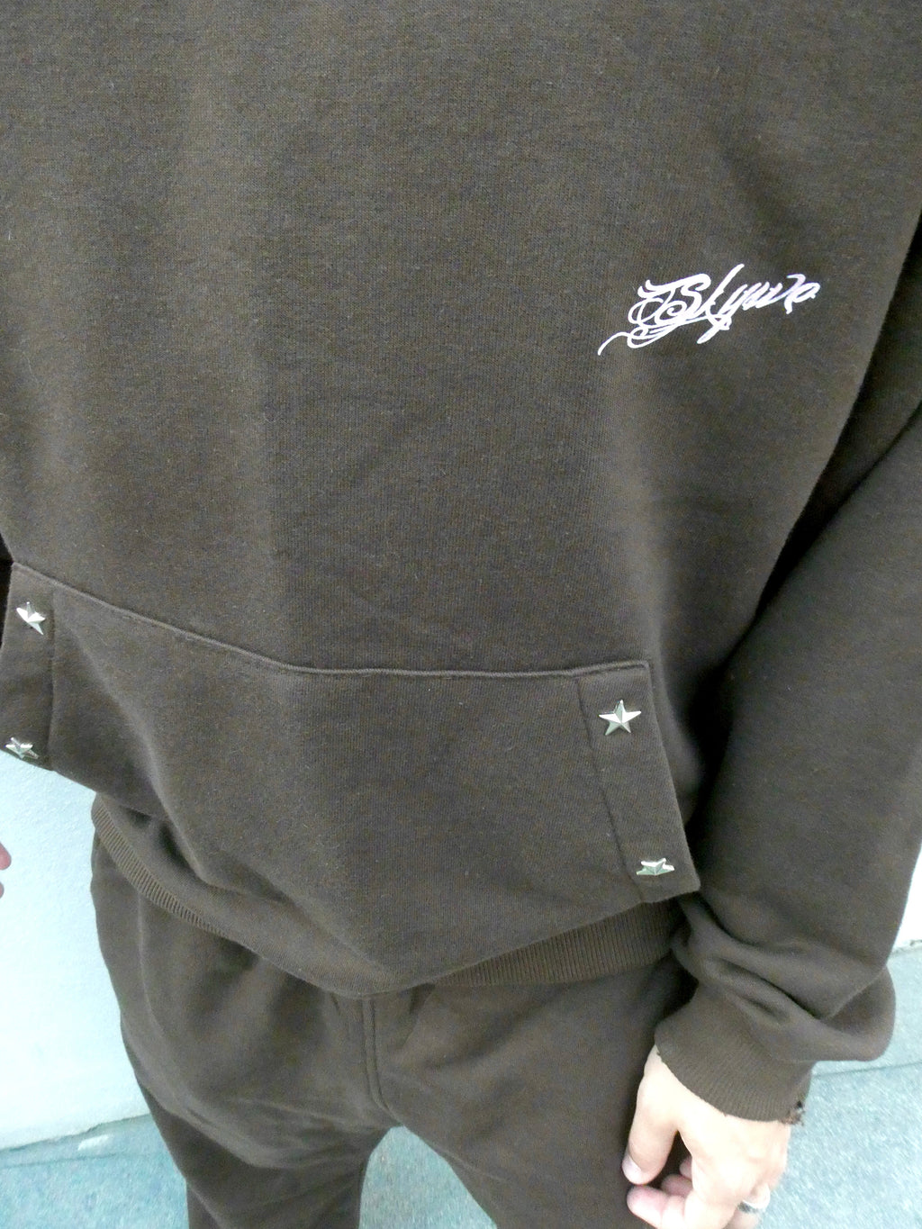 SKYWEB rust oversized hoodie in french terry cotton featuring silver star studs on the kangaroo pocket and logo