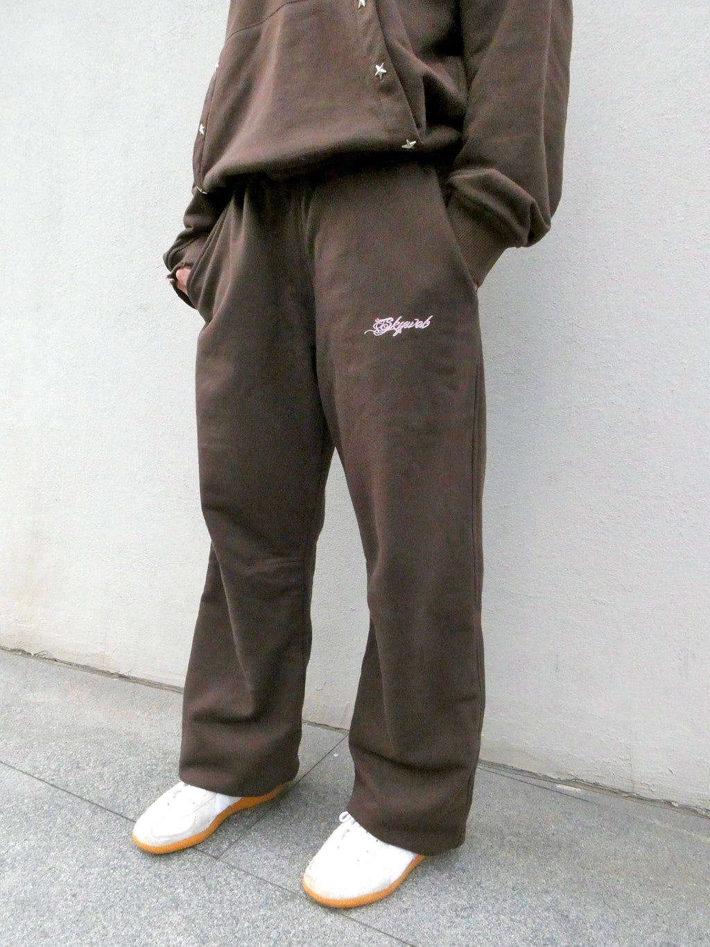 SKYWEB rust coloured wide leg french terry cotton sweatpants with embroidered logo and elastic drawcord waist