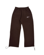 SKYWEB rust wide leg sweatpants in french terry cotton with an elastic waist, adjustable hem cords, and logo detail.